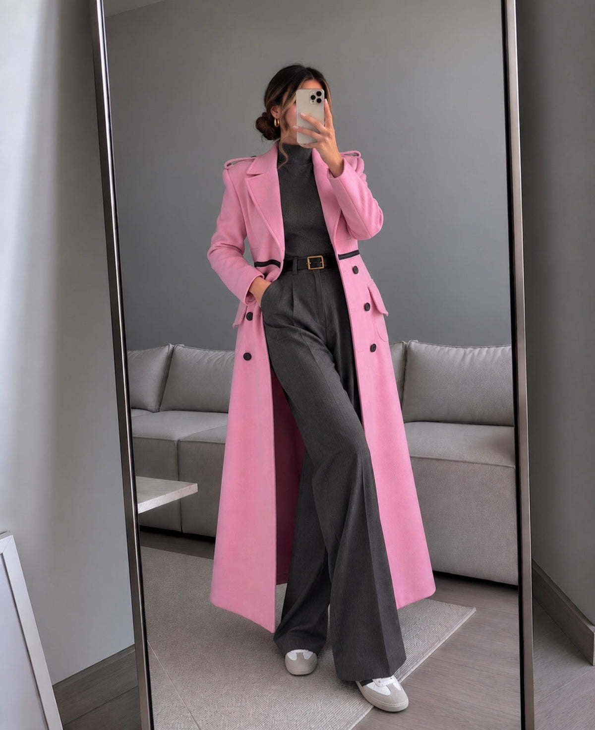 The RAYNA dusty pink longline coat by Mateeno, styled over a charcoal ribbed roll neck and grey wide-leg trousers with white trainers